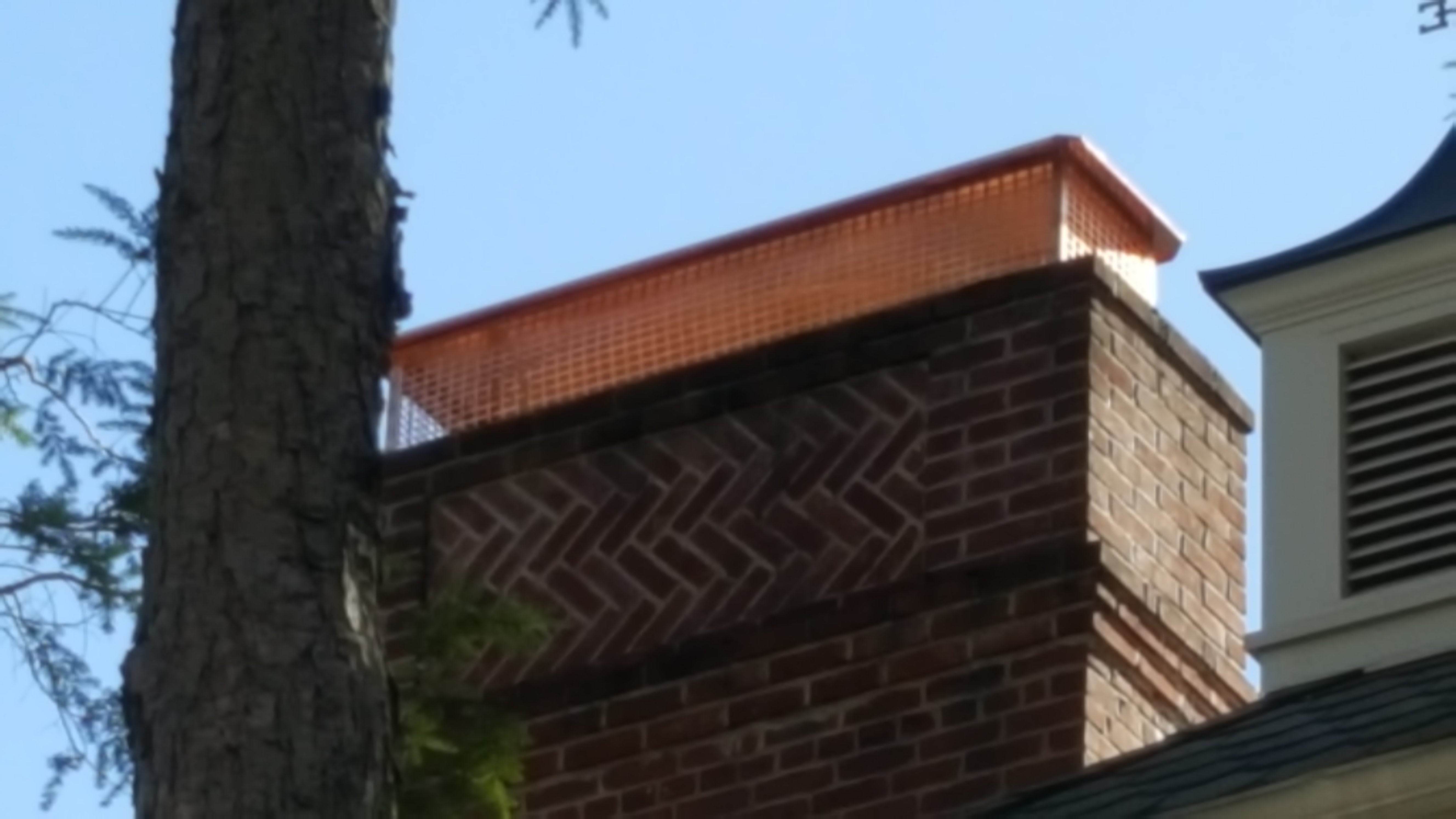 New stainless steel chimney cap installed in Valley Stream, NY